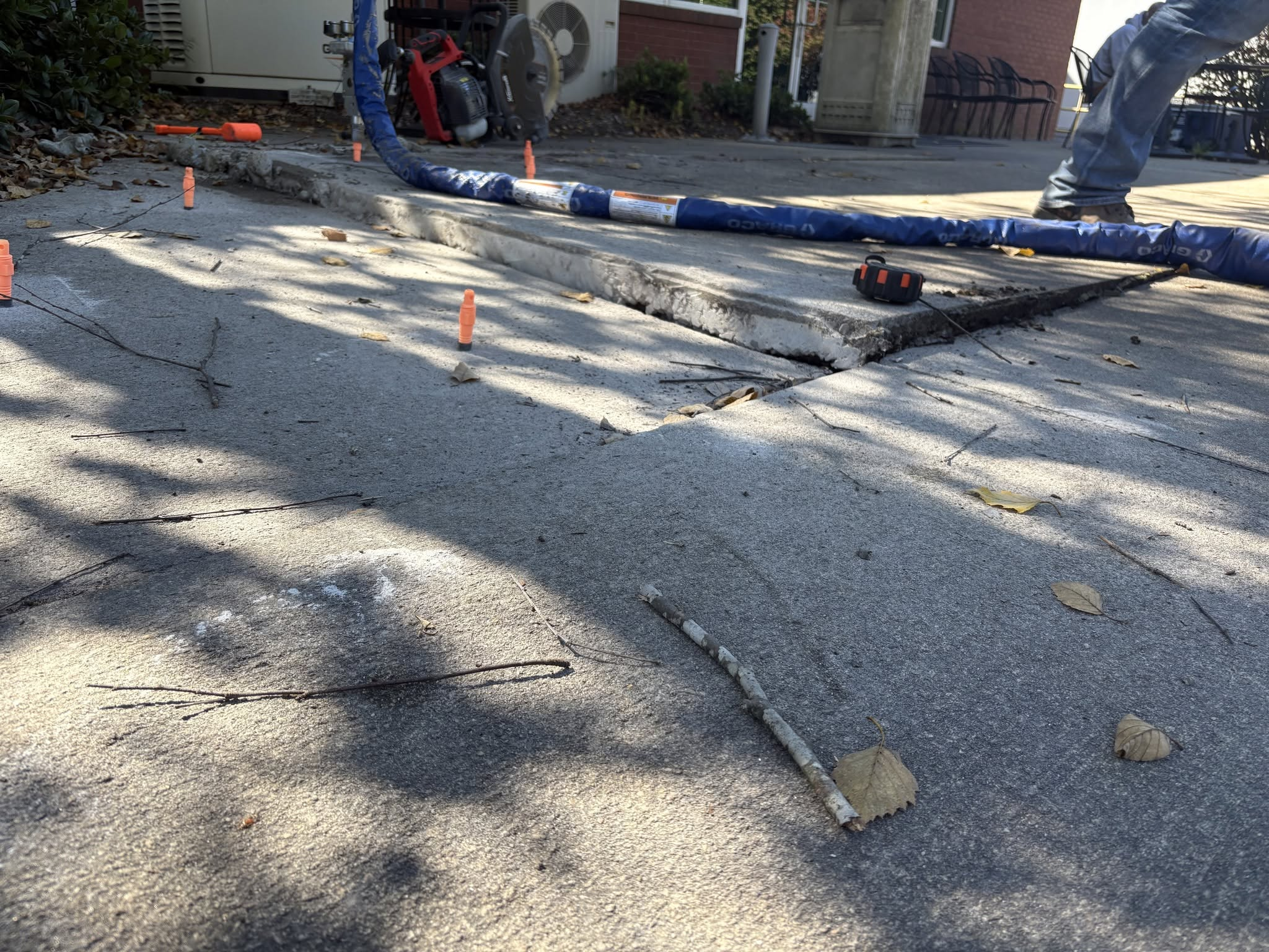 Sunken commercial sidewalk slabs with large step-off